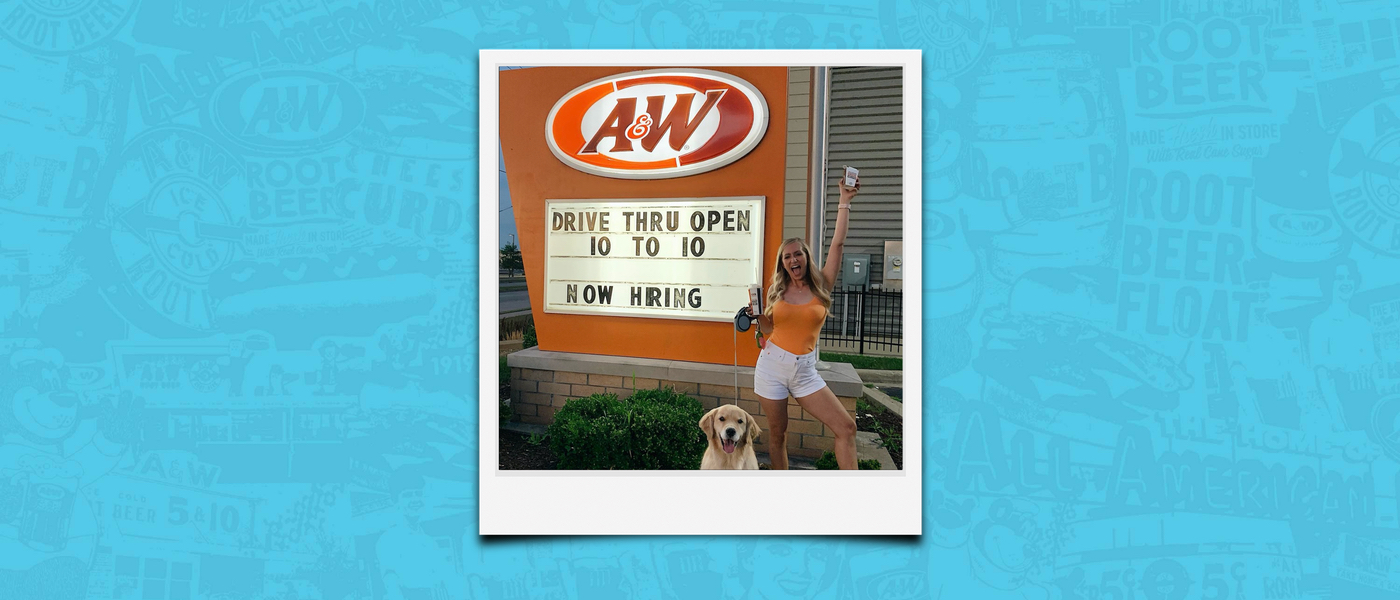 Background is blue. Polaroid of Tara Rushmer in front of A&W Restaurant holding a box of Cheese Curds in the air